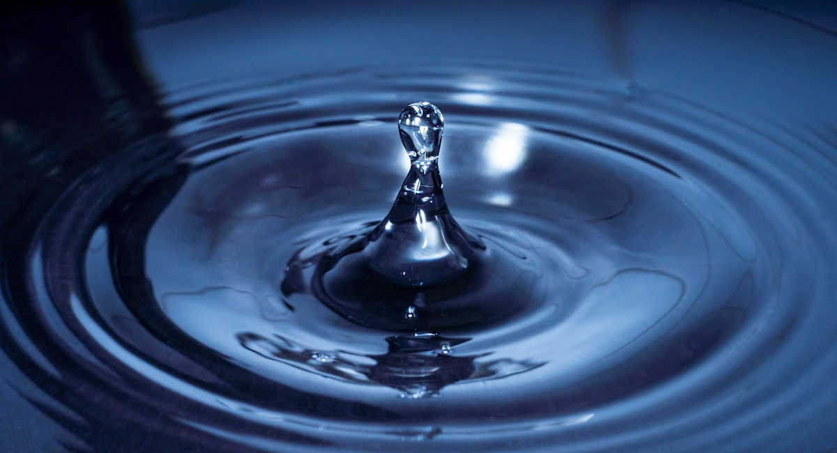 water creating ripples representing our effect on the systems of which we're a part.